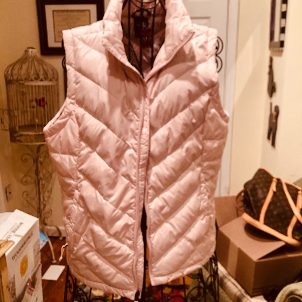 Northface pink puffer vest.  Great condition.  MOVING SALE!!